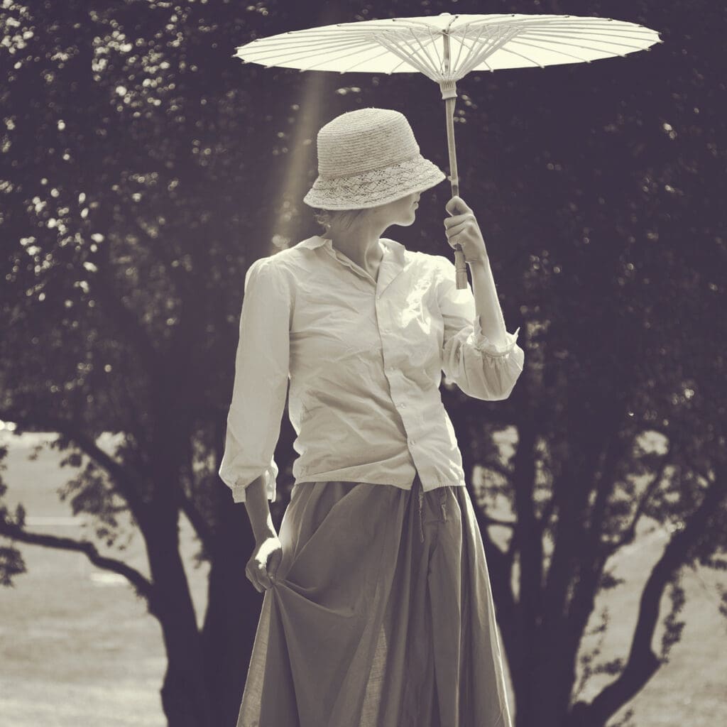 vintage woman holding a parasol 