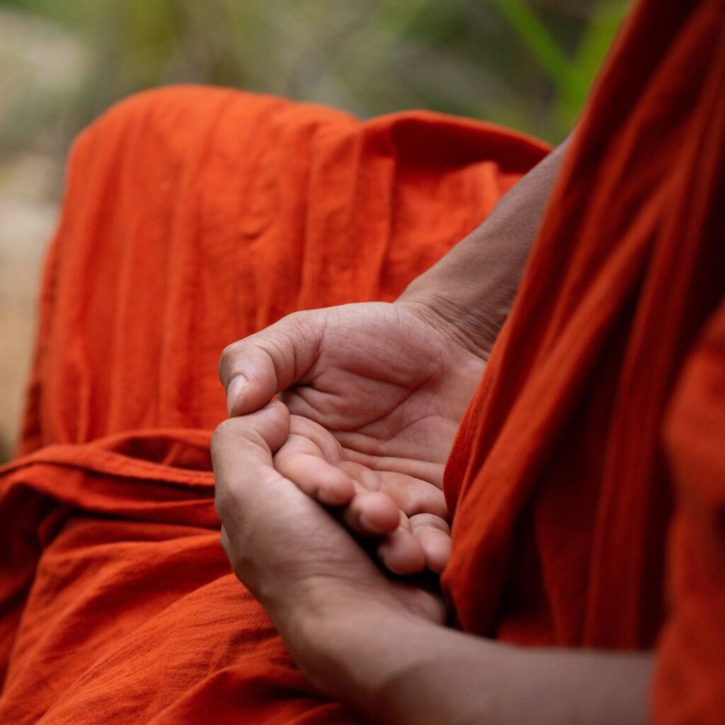 Tibetan monk seated in meditation.