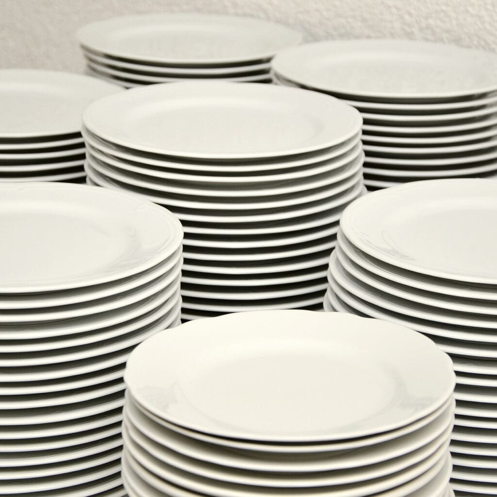 Stacks of clean, white plates.