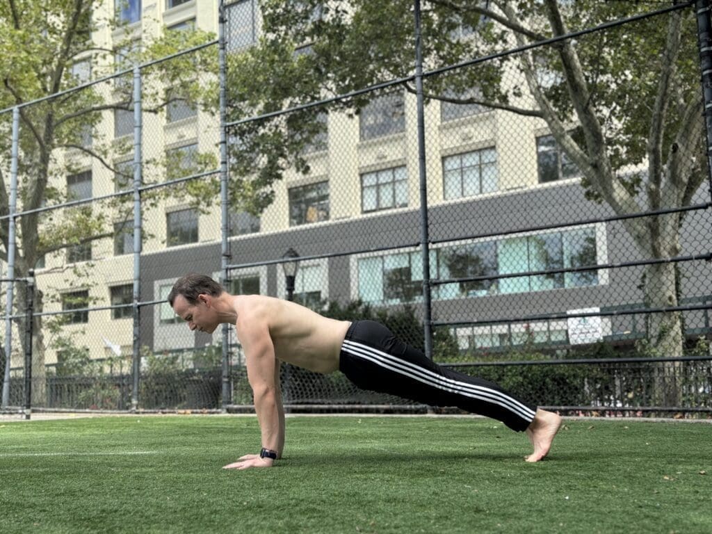 James Donegan performs Plank Pose