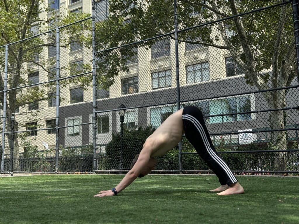 James Donegan performs Downward Facing Dog