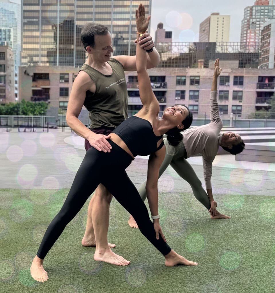 James Donegan teaching triangle pose