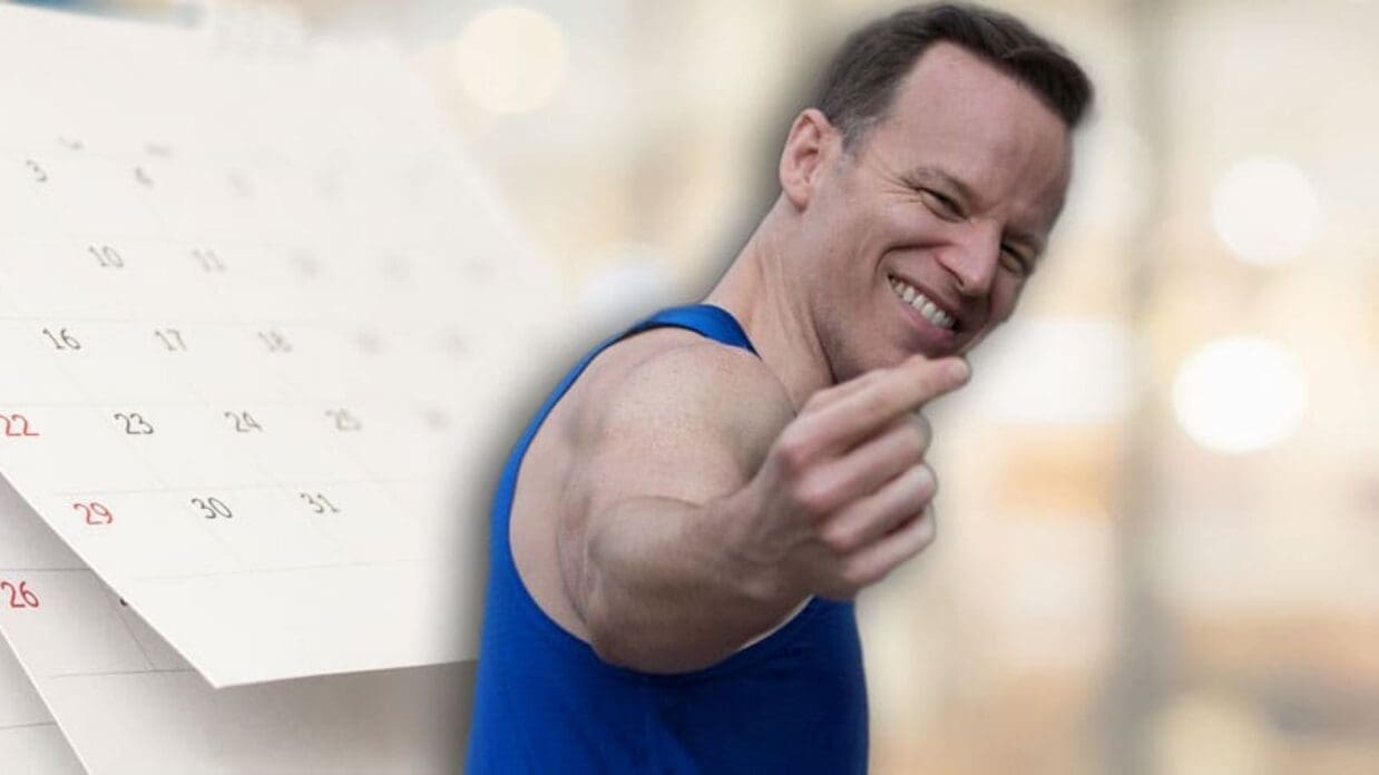 James Donegan in front of a calendar inviting people to join him