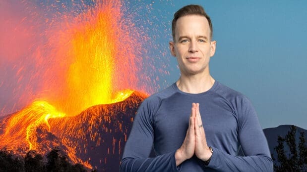 James stands in front of an ai-generated volcano