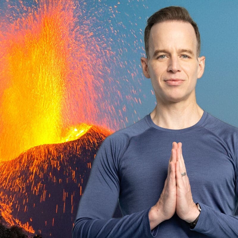 James stands in front of an ai-generated volcano