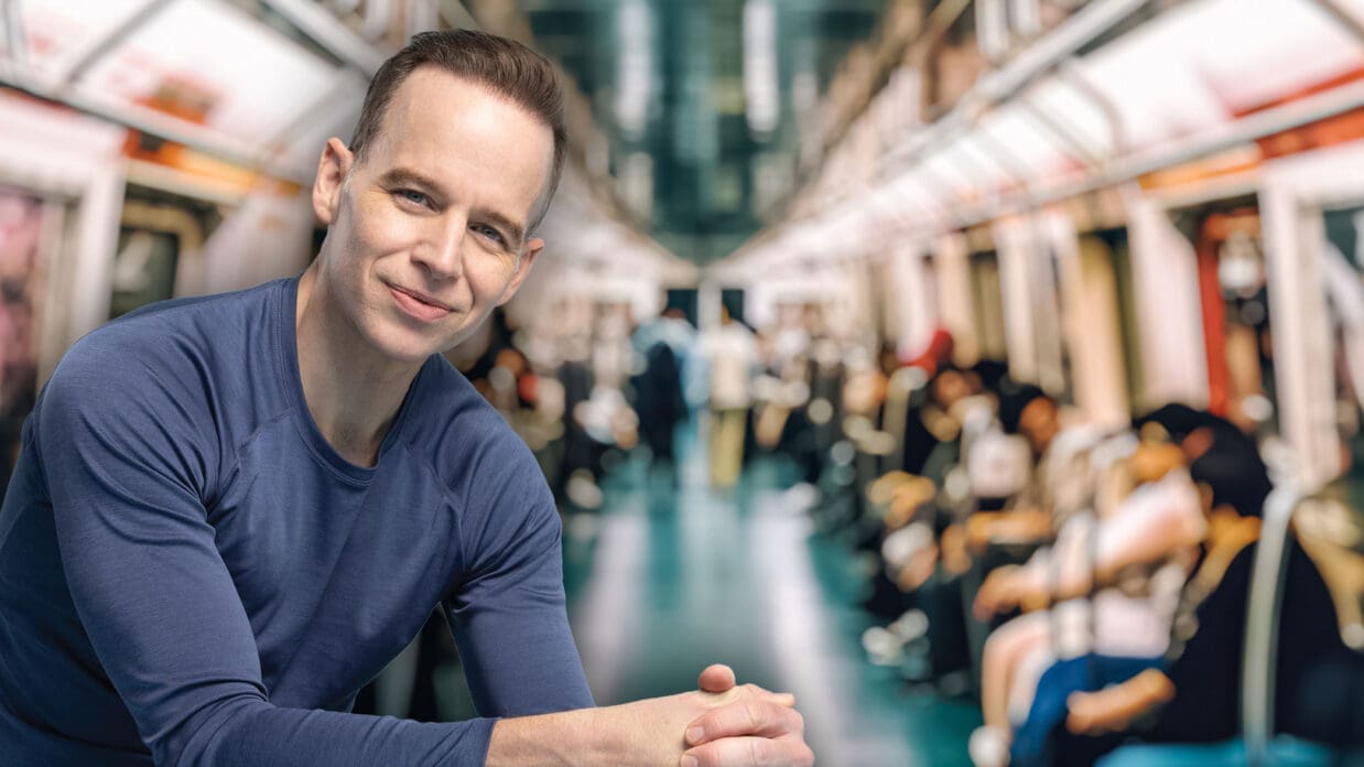 James Donegan peacefully in a busy subway car