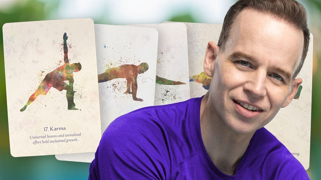 James Donegan in front of a spray of yoga oracle cards